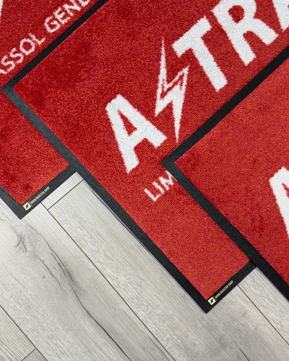 Detail of custom logo on indoor business floor mat