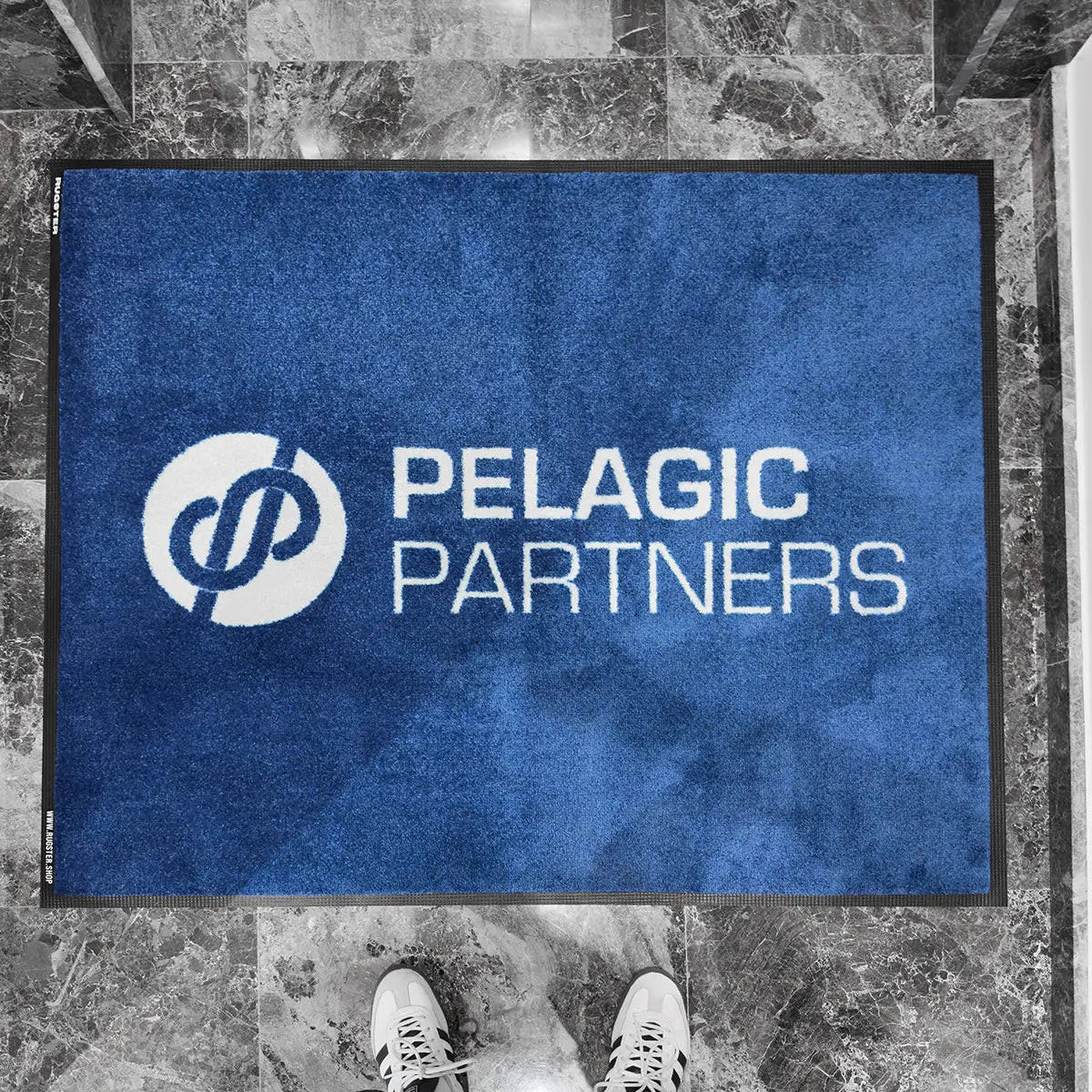 Office indoor logo mat with blue background