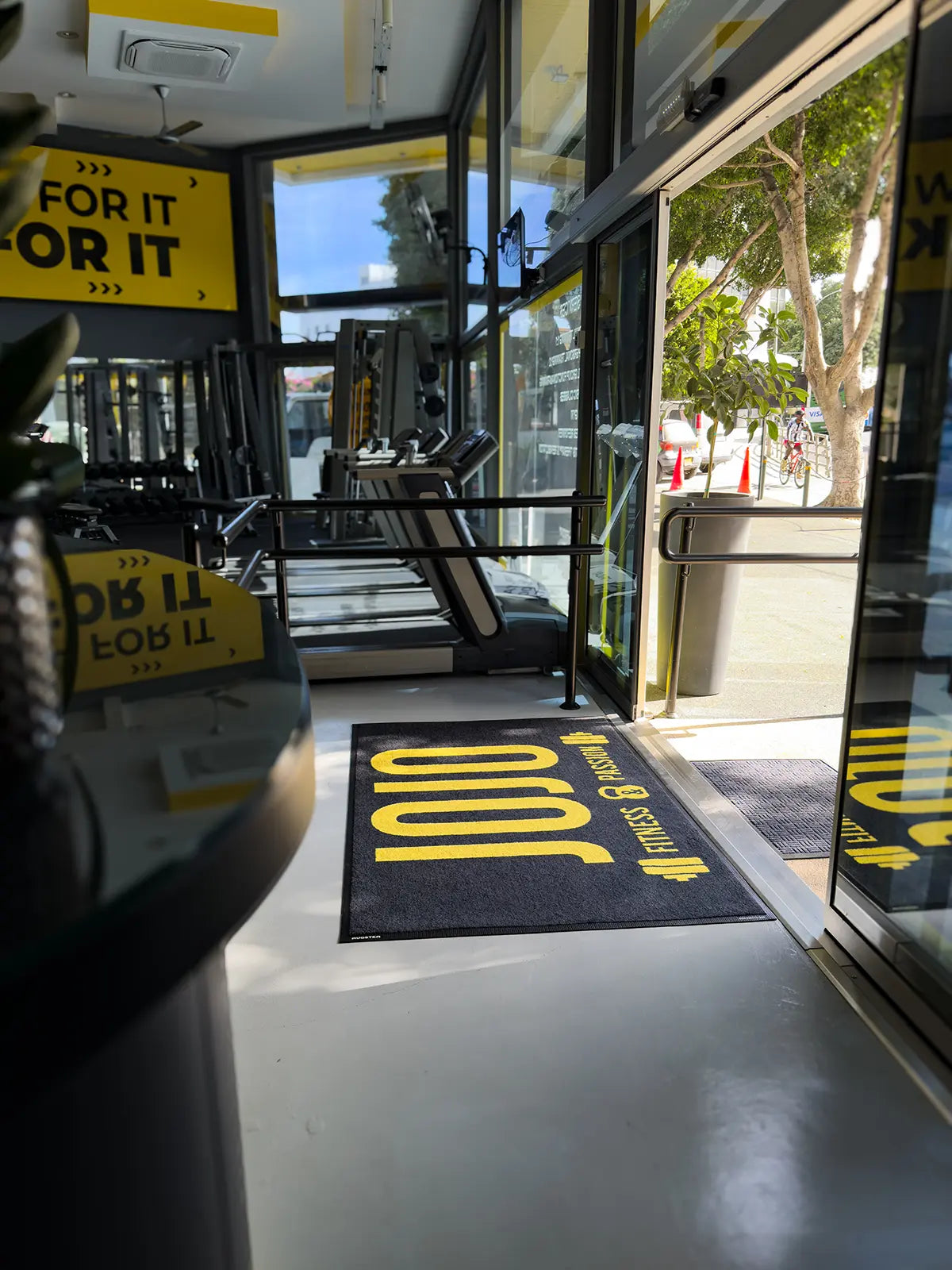 Indoor logo mat at gym entrance with custom print
