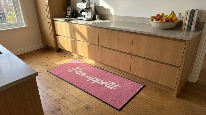 Pink custom text mat in a kitchen