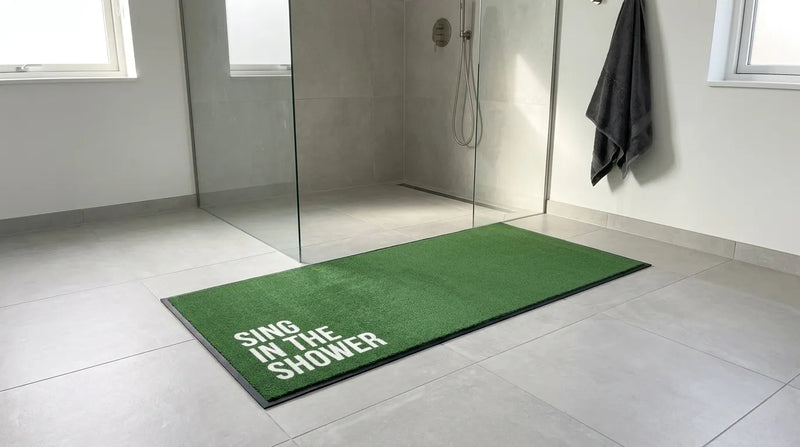 Green custom text mat in a bathroom