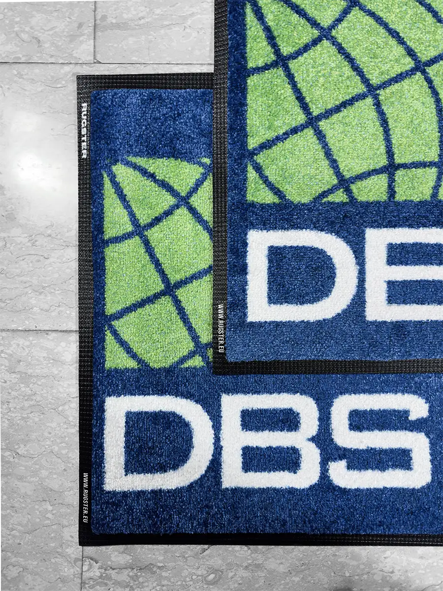 Navy blue background indoor logo mats with green and white logo print